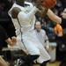 Huron senior Kendall Thomas looks to shoot a basket in the second half against Pinckney during a district match up at Pioneer on Wednesday. Melanie Maxwell I AnnArbor.com